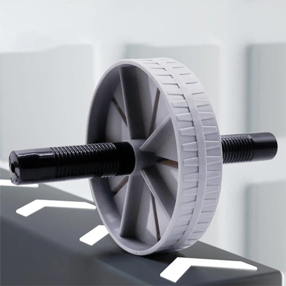 AB Roller Wheel Placed on the Floor for Core Strength Training and Home Workout