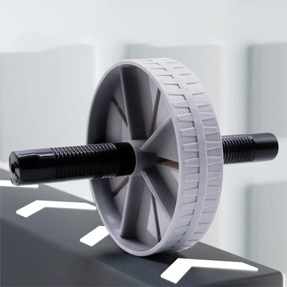 AB Roller Wheel Placed on the Floor for Core Strength Training and Home Workout